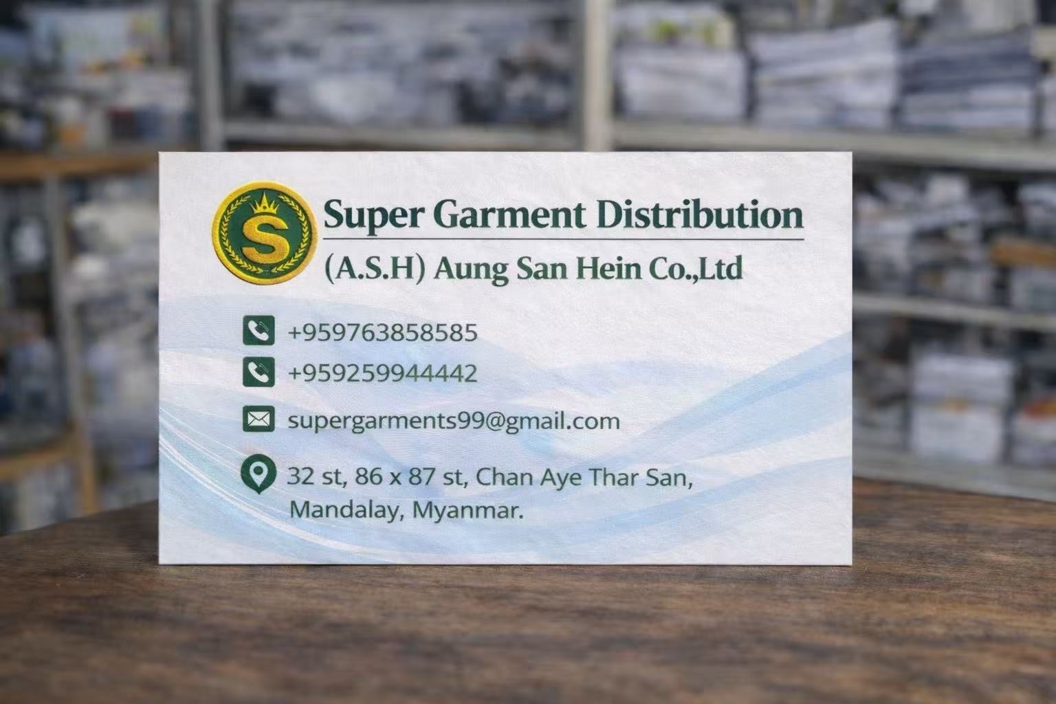 Super Garment Distribution gold S emblem